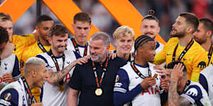 Postecoglou with his victorious Tottenham players after the Europe League triumph.