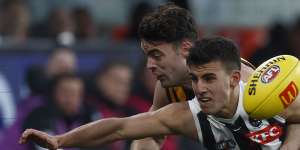 Nick Daicos was in the thick of the action for Collingwood against Hawthorn before succumbing to a knee injury.