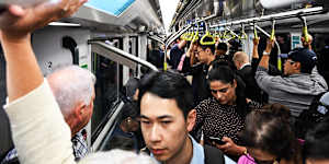 Commuters pack a CBD-bound metro train during the morning peak.