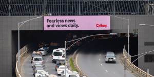Crikey advertising on an electronic billboard on Kings Way in Melbourne.