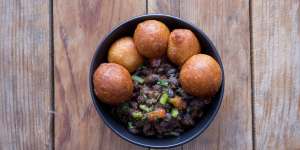 Black beans with puff puff.