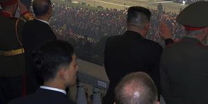 North Korean leader Kim Jong-un (centre) watches a Hwasong-18 intercontinental ballistic missile during the parade.