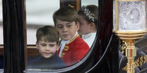 Prince Louis,Prince George and Princess Charlotte,from left,arrive back at Buckingham Palace.