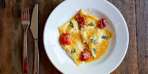 Ricotta ravioli with cherry tomatoes. 
