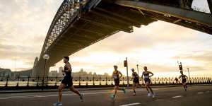 Runners passing under the Sydney Harbour Bridge.