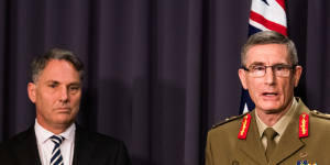 Australian Defence Minister Richard Marles and Chief of the Defence Force Angus Campbell,who has had his term extended by two years.