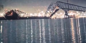 ‘Something out of an action movie’:US bridge collapses after ship crashes into pylon