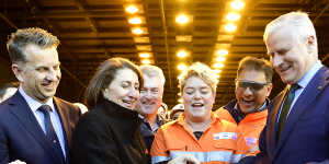 NSW Transport Minister Andrew Constance,left,Premier Gladys Berejiklian,training coordinator Marlee Mirabito and Deputy Prime Minister Michael McCormack cut the ribbon on Friday to officially open the new tunnels.