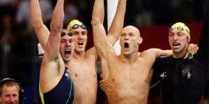 Ashley Callus,Chris Fydler,Michael Klim and Ian Thorpe celebrate their gold in the 4x100m relay. The Australians set a world record of 3:13.67 while Klim also broke the individual world record,finishing his leg in 48.18s. 