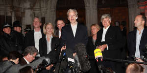 Robinson with Julian Assange,centre,after he was granted bail in 2010,and Geoffrey Robertson,second from right.