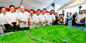 Then Malaysian Prime Minster Najib Razak,third from left,looks at modals of ECRL (East Coast Rail Link) during the project launching in Kuantan,east cost of peninsula Malaysia in 2018.