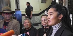 Hana-Rawhiti Maipi-Clarke (right) and her colleagues from Te Haiti Māori talk to reporters after the protest inside parliament.