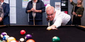 Morrison plays a game of pool at a retirement village in Mount Duneed in the seat of Corangamite. 