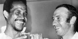 Second innings heroes ... World XI captain Garry Sobers (254) and Australia’s Doug Walters (127) celebrate their impressive numbers.