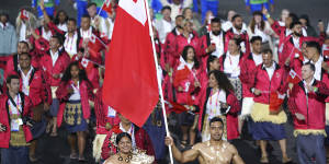 Team Tonga enter the Alexander Stadium during the opening ceremony of the Commonwealth Games.