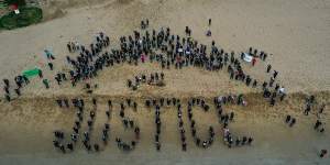 In Torquay rather than a march women gathered on the beach spelling out the word ‘JUSTICE’ on the sand on Monday.