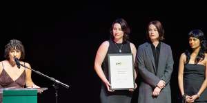 WAR presdient Bridget Raffal accepts the award for Cultural Change Champion.