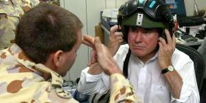 Former prime minister John Howard preparing to visit Australian troops in Iraq in 2004.