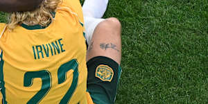 Shattered Socceroos after their loss,including Nestory Irankunda and Jackson Irvine .