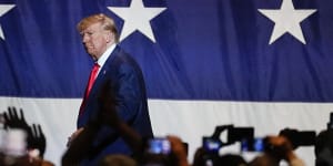 Former president Donald Trump,leaves the stage after speaking at the Georgia Republican convention in June.