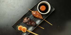 A platter with tsukune (chicken meatball),wagyu and scallop skewers.