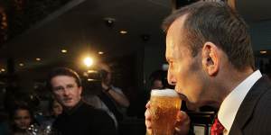 Tony Abbott enjoys a beer during his time as opposition leader.