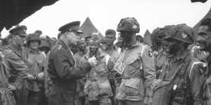 US Army General Dwight D. Eisenhower,who directed the invasion,gives the order of “Full victory,nothing else” to paratroopers in England on June 6,1944,just before they boarded their planes for the first assault.