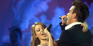 Robbie Williams and Kylie Minogue sing at the MTV Europe Music Awards in 2000.