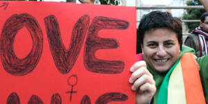 A gay-rights protester holds a banner in Beirut,Lebanon,in 2009.