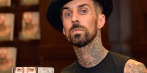 Travis Barker attends a signing of his book"Can I Say:Living Large,Cheating Death,And Drums,Drums,Drums"on October 20.