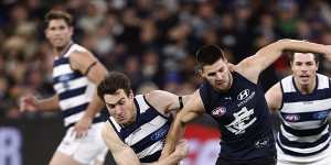 Jeremy Cameron tackles Carlton’s Nic Newman during Geelong’s win.