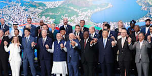 Prime Minister Anthony Albanese (front,second from right),holds hands with China’s Xi Jinping at the G20 summit in Rio de Janeiro,Brazil. 
