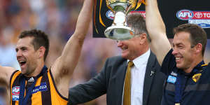 Alastair Clarkson (right) and Hawthorn skipper Luke Hodge hold the 2015 premiership cup aloft. The Hawks have not won a final since.