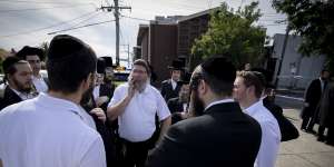 Yumi Friedman (centre) was inside the synagogue when the building was firebombed.