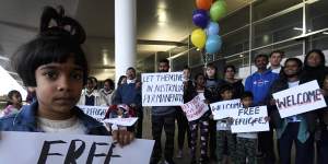 Supporters welcoming the Murugappan family at Perth Airport last week. 