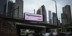 Crikey advertisement on the train bridge at Flinders and Spencer Streets in Melbourne on Friday.