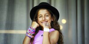 Milana Bruno,9,wearing the black top hat given to her by Taylor Swift at her MCG concert on Friday night,