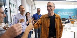 Svante Paabo toasts with champagne with his colleagues at the Max Planck Institute for Evolutionary Anthropology in Leipzig.