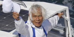 Japan’s Kenichi Horie waves on his sailing boat after his trans-Pacific voyage,at Osaka Bay,western Japan,Saturday,June 4,2022. The 83-year-old Japanese adventurer returned home Saturday after successfully completing his solo,nonstop voyage across the Pacific,becoming the oldest person to reach the milestone.