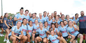 The Waratahs celebrate their Super Rugby Women’s grand final victory on Sunday. 
