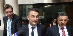 Joseph Georges (centre) leaves the ICAC inquiry in 2013 after being questioned on his connection to the Obeids.
