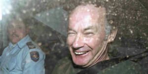 Convicted murderer Ivan Milat leaves an appeal court in a police car,November 4,1997,in Sydney. Milat was appealing his 1996 conviction in the so-called"Backpacker Murders".