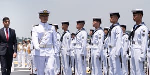 British Prime Minister Rishi Sunak inspects a guard of honour onboard the Japanese aircraft carrier JS Izumo at Yokosuka Naval Base on Thursday,ahead of the G7 Summit in Hiroshima.