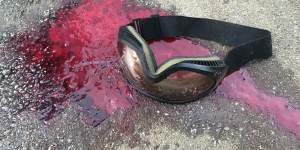 Blood and goggles left on road after police moved in at Hong Kong Polytechnic University. 