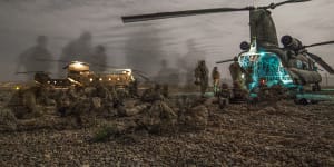 Australian Army soldiers from Special Operations Task Group prepare for a night-time operation in Oruzgan in 2008.