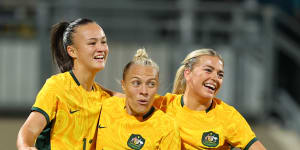 Amy Sayer,Tameka Yallop and Charlotte Grant celebrate a goal for the Matildas in November 2023.