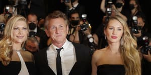 Leila George and Sean Penn pose for photographers at the Cannes film festival on July 10,2021. 