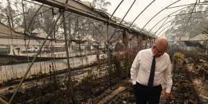 Prime Minister Scott Morrison tours a bushfire-damaged farm in Sarsfield.