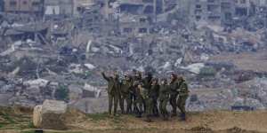 Israeli soldiers pose for a photo on a position on the Gaza Strip border,in southern Israel,last month.