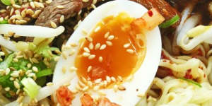 Ramyeon noodles with spicy broth,chilli beef,soft-boiled egg and kimchi.